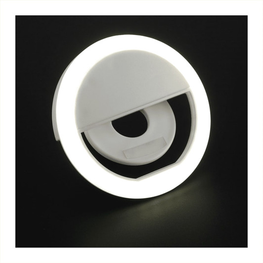 A circular white LED light designed for laptops, featuring a built-in clip for attachment.
