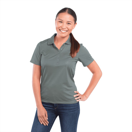 A green short sleeve polo shirt for women, featuring a collar and buttons, worn by a smiling model.