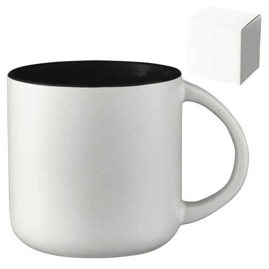 A ceramic mug with a white exterior and black interior, presented alongside a plain gift box.