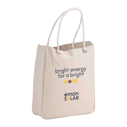 A beige organic cotton tote bag with rope handles, featuring a logo and text on the front.