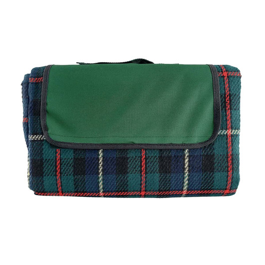 A folded picnic rug featuring a green top and a plaid pattern in blue, red, and cream colours. It has a carrying handle and a logo.