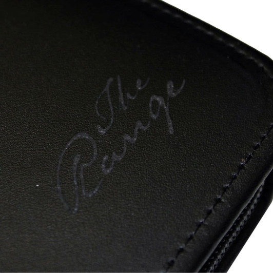 A black leather travel wallet with a subtle logo embossed on the surface.