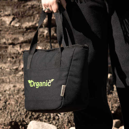 A black cooler tote bag with short handles and a logo. It features a green design element and is made from recycled canvas.