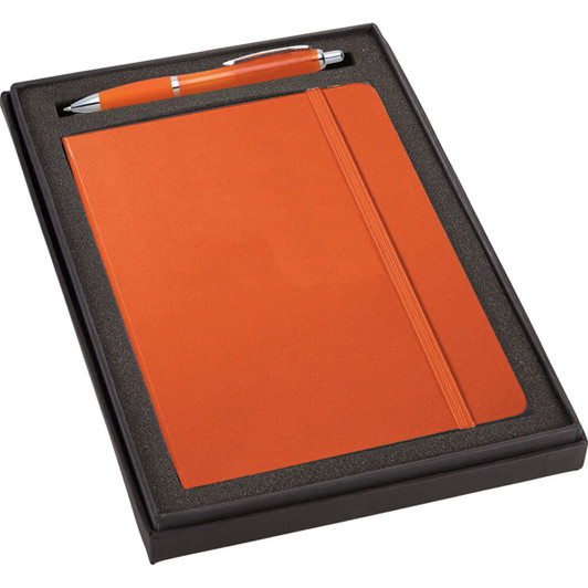 An orange journal and silver pen presented together in a sleek black gift box.
