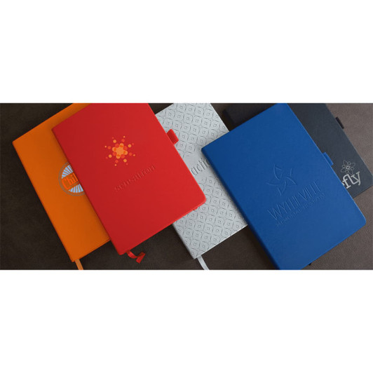 A collection of five notebooks in orange, red, grey, and blue, featuring various designs and logos.