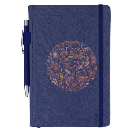 A navy blue journal with a decorative round design and a matching pen attached. It features a logo on the cover.