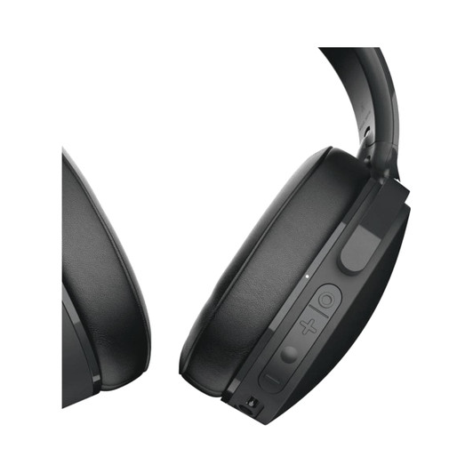 A pair of black wireless headphones featuring controls and a logo, showcasing a sleek design.