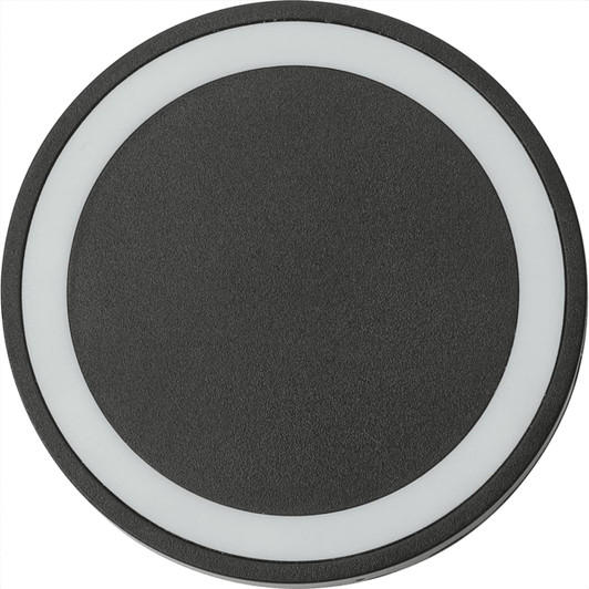 A round wireless charging pad in black with a white accent ring around the edge. It has a textured surface and a logo.
