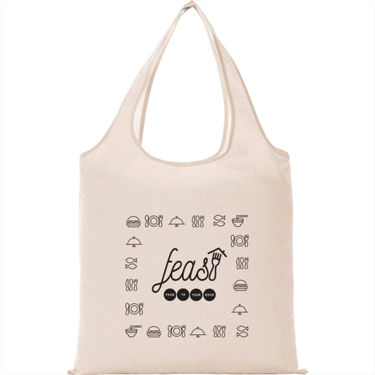 A beige cotton canvas tote bag with a black food-themed graphic design in the centre. The bag features a logo.