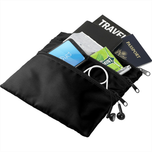 A black travel pouch containing a phone, passport, notebook, gum, and headphones, with visible zippers.