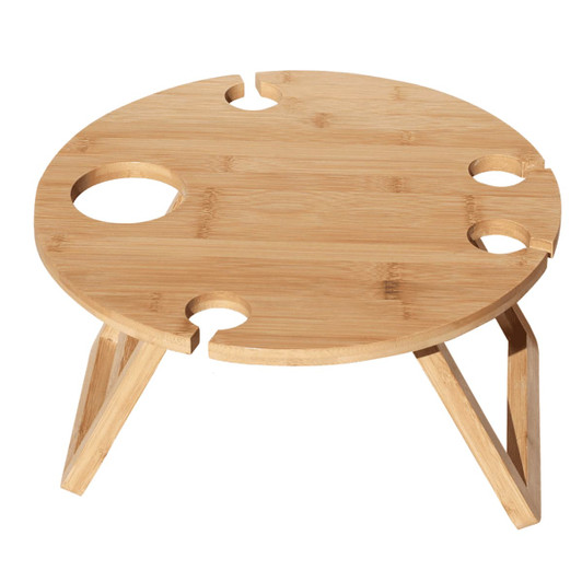 A circular bamboo picnic table with four drink holders and wooden legs, featuring a natural finish.