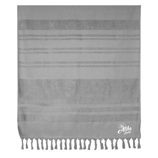 A grey flat towel with striped patterns and tassels along the bottom, featuring a logo in the corner.
