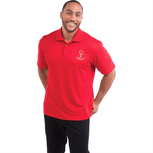 A red short sleeve polo shirt for men, featuring a logo on the chest. Man smiling while wearing the shirt.