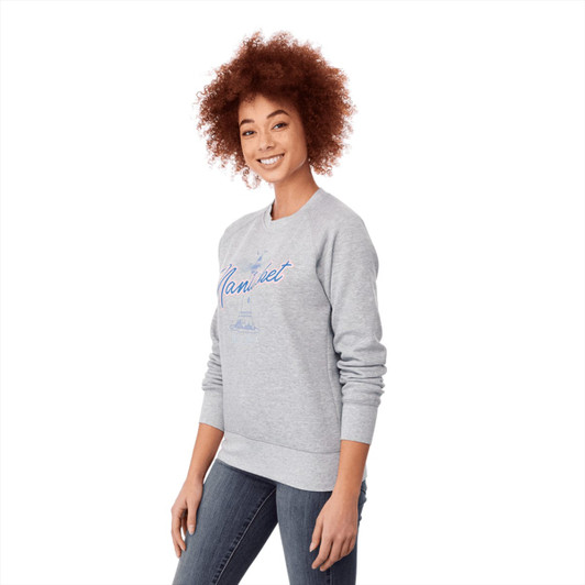 A grey women's jumper featuring a crew neckline and a branding logo, styled with a relaxed fit.