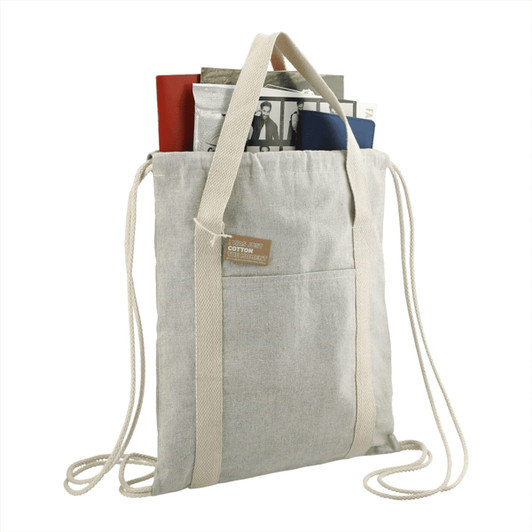 A light grey drawstring bag made of recycled cotton, featuring handles and a front pocket, holding various items.