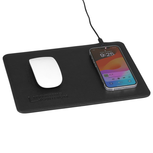 A black wireless charging mouse pad with a white mouse and a smartphone connected via a cable.