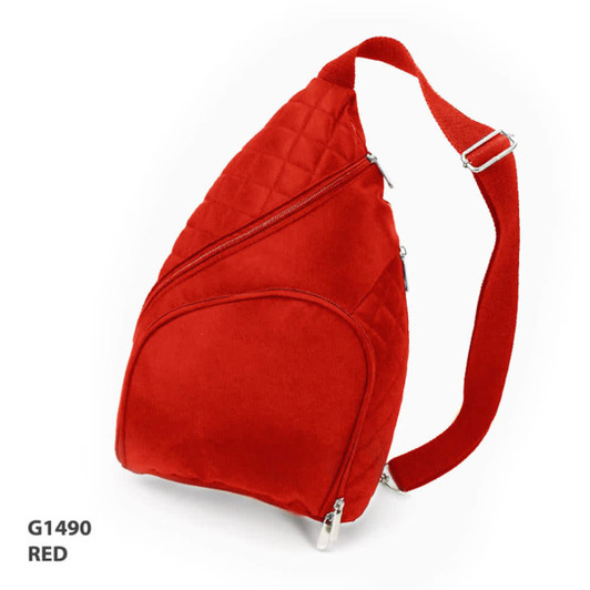 A red Traveller Bag with a unique triangular shape, featuring adjustable straps and multiple zippered compartments.