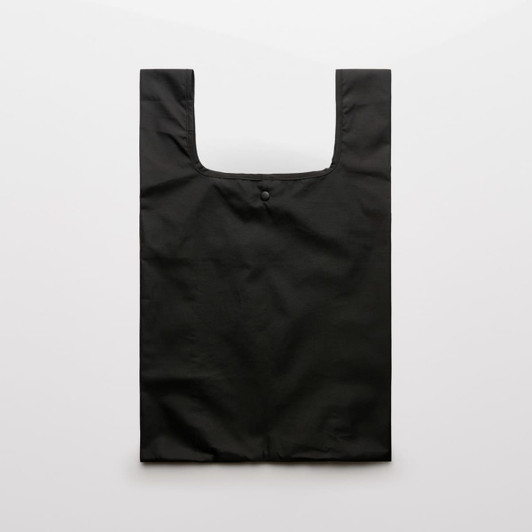 A black reusable grocery bag with a simple design and a button closure at the top.