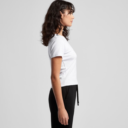 A white organic rib baby tee with a fitted design, displayed from the side. The model is wearing black bottoms.