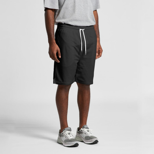 Black sports shorts with an elastic waistband and white drawstring, worn by a person standing.