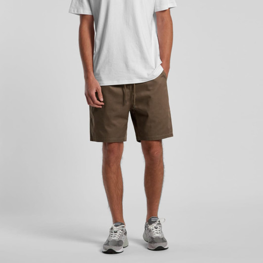 Brown 18" walk shorts displayed on a model wearing a white t-shirt and grey shoes, featuring a drawstring waist.