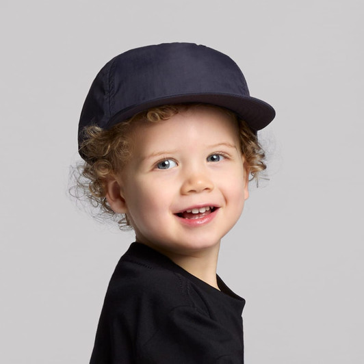 A navy cap designed for kids, featuring a structured brim and an adjustable fit.