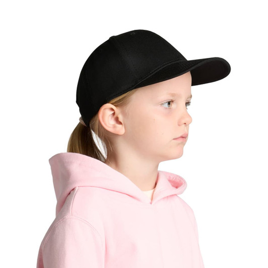 A black cap designed for kids, featuring a structured front and a curved brim, worn by a child in a pink hoodie.