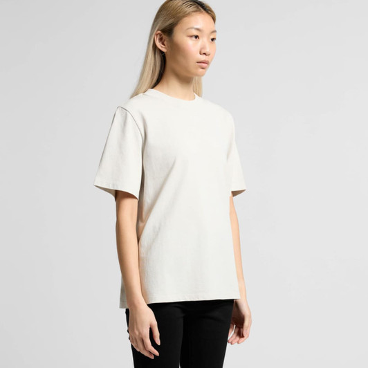 A light beige heavy faded tee displayed on a model, featuring short sleeves and a relaxed fit.
