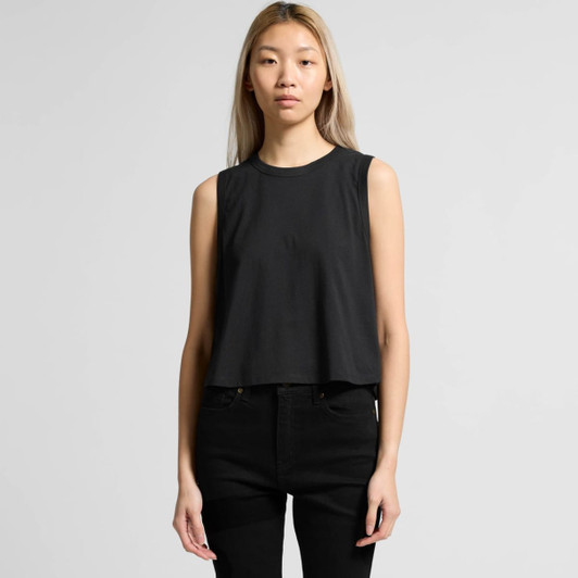 A sleeveless black crop tank top with a simple design, worn by a model with long hair.