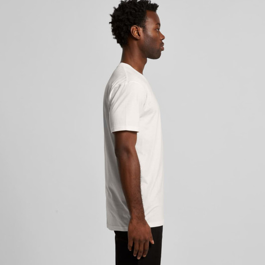 A white organic t-shirt displayed on a model from the side, featuring a simple design and a logo.