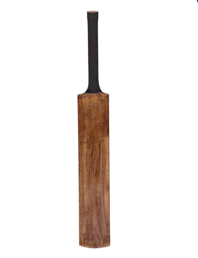 A wooden cricket bat with a black handle, featuring a smooth, polished surface. It has a minimalist design.