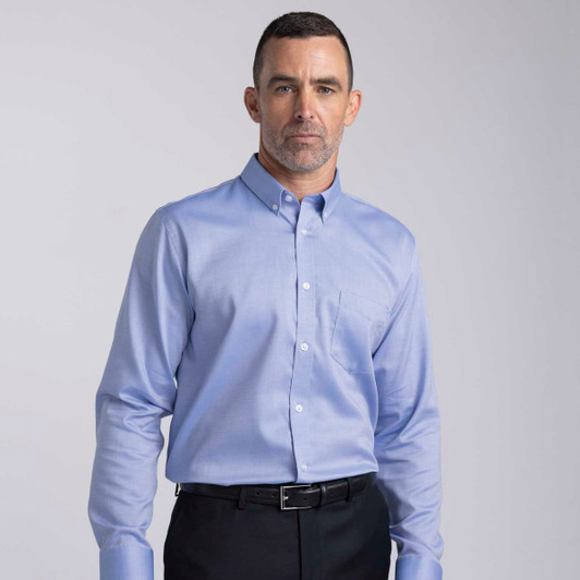 A light blue button-up shirt for men featuring long sleeves and a breast pocket, with a logo present.