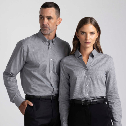 A grey button-up shirt for men and women, featuring a subtle pattern and tailored fit. The design includes a logo.