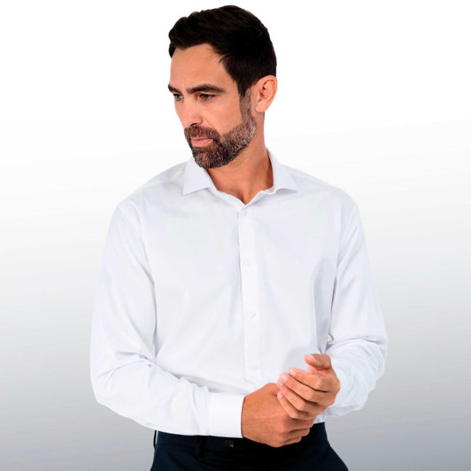 A man wearing a white button-up shirt with a collar, featuring a logo on the chest.