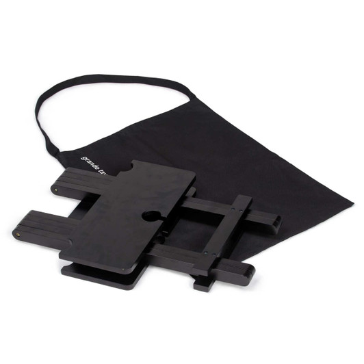 A black folding table with a carry bag, suitable for outdoor leisure activities. It has a simple design and sturdy construction.