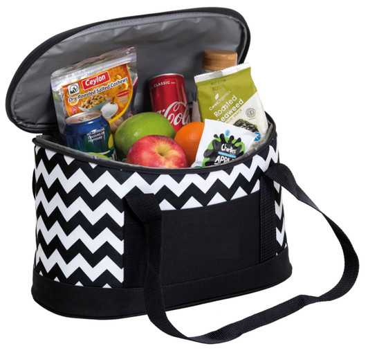 A cooler bag in black and white chevron design, filled with drinks, snacks, fruit, and a bottle. Features dual handles.