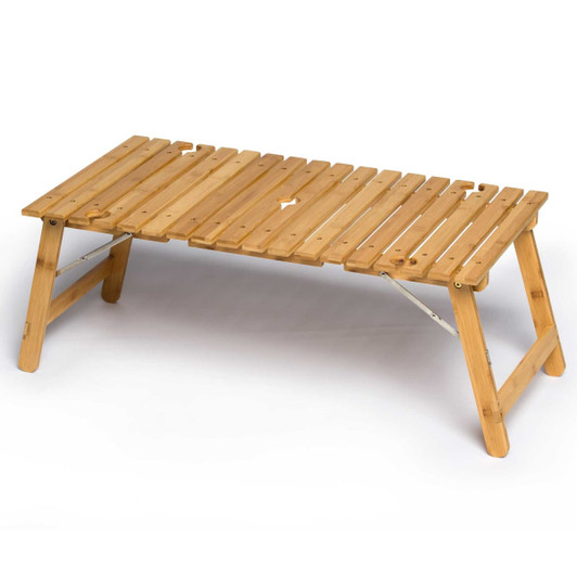 A bamboo folding table with a slatted top and a natural finish, featuring an integrated centre hole for an umbrella.