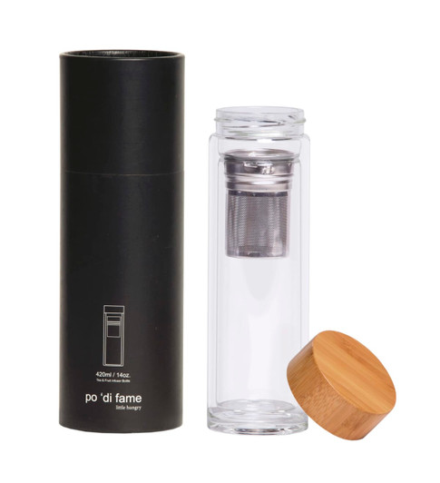 A drink bottle featuring a clear glass design with a bamboo lid and a metal infuser, housed in a black cylindrical box.