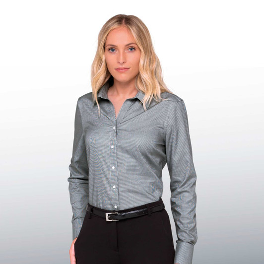 A woman models a long-sleeve, button-up shirt in a greyish shade, featuring a subtle pattern and a collar.