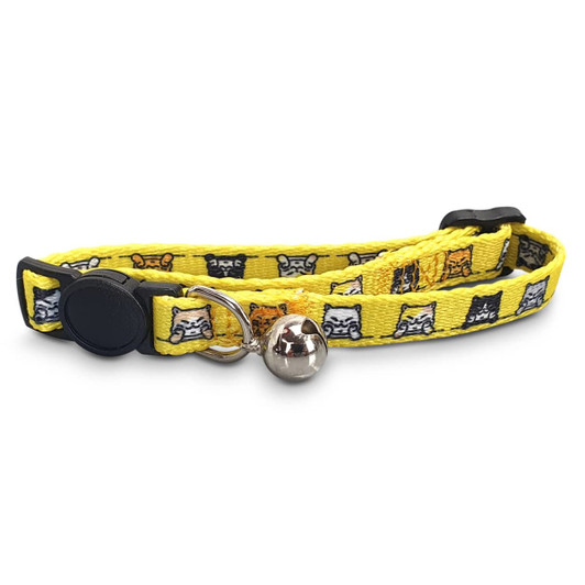 A yellow cat collar featuring a pattern of cats, with a silver bell and adjustable clasp. It has a logo on it.