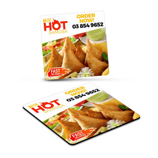 A square fridge magnet featuring golden samosas, garnished with herbs, in vibrant colours. It has a logo and promotional text.