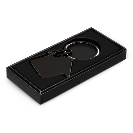 A black key ring in the shape of a house, presented in a sleek black box.