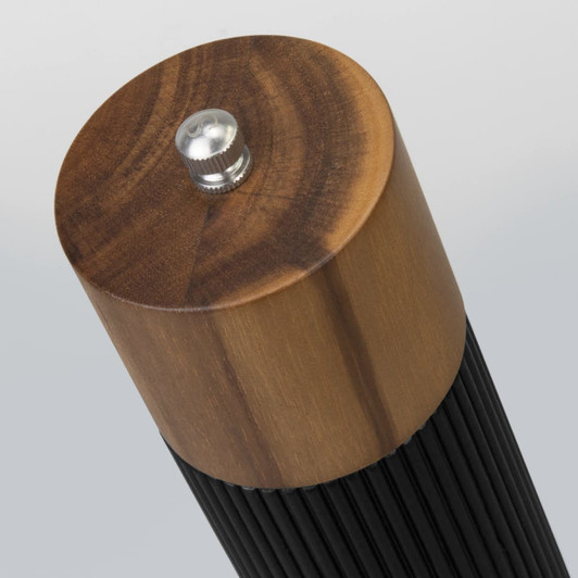 A sleek salt and pepper grinder in black and natural wood with a metallic top detail.