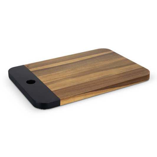 A wooden serving board in natural tones with a black accent, featuring a rounded corner and a hole.
