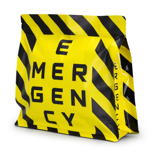 A large, yellow and black foil flat bottom pouch with a logo and bold striped design.
