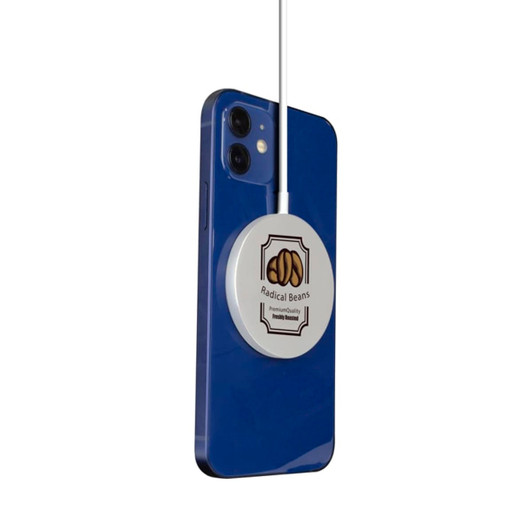A blue smartphone with a white, circular magnetic wireless charger attached, featuring a logo.