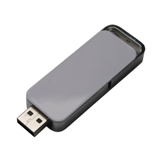 A silver flash drive with a sleek design and a metallic finish, featuring a logo on one side.