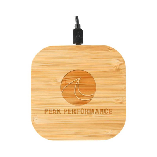 A square bamboo wireless charger with a cable attached and a logo engraved on the surface.