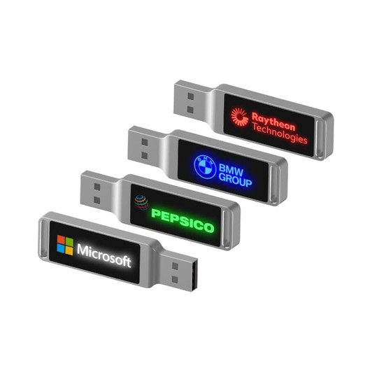 A set of four LED flash drives in silver, featuring various logos on illuminated displays.