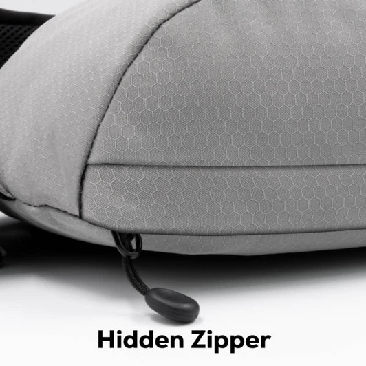 A grey Sling Eco Bag featuring a textured surface and a hidden zipper detail. Includes a logo on the side.